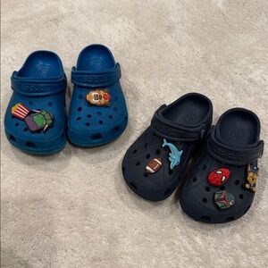 2 pairs CROCS Kids Navy and Teal Slippers with Fun Charms